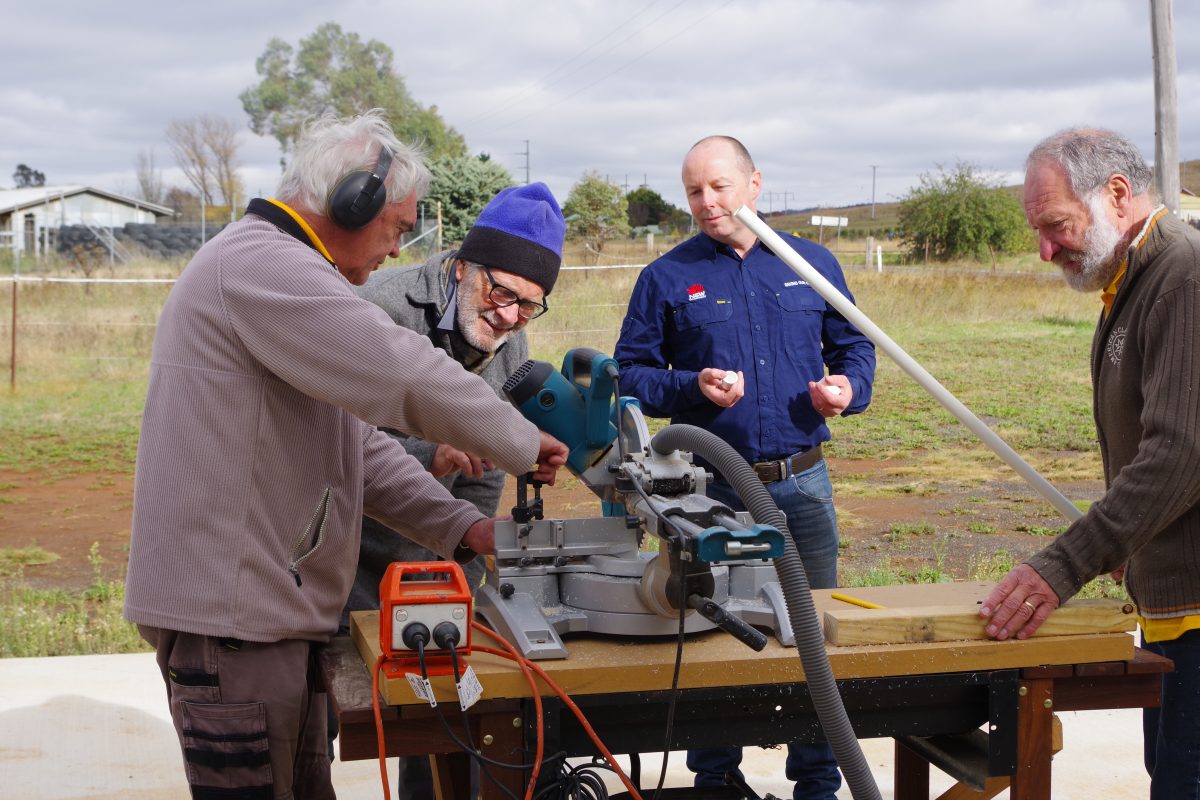 Members of the Cooma Men's Shed with ecologist Rob Armstrong.