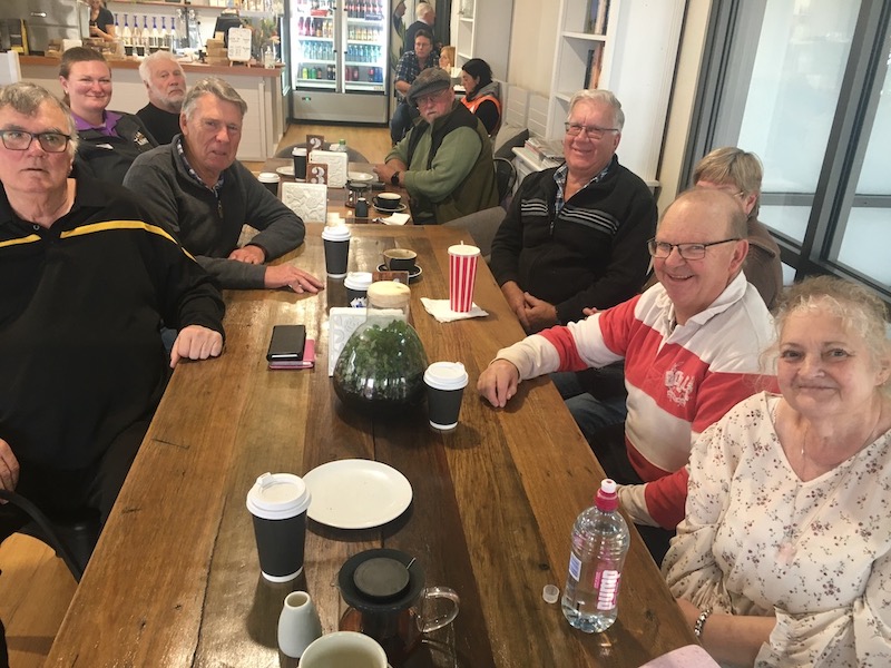 People enjoying coffee at a table