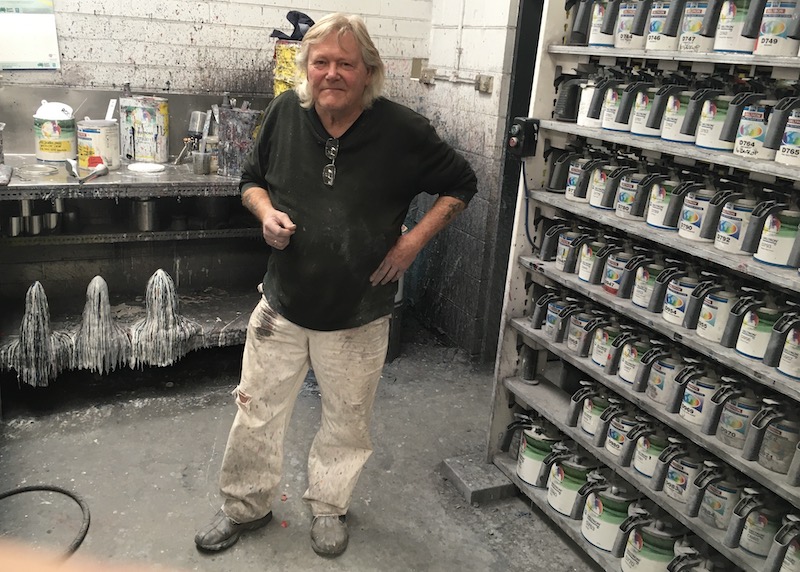 man in paint and panel shop