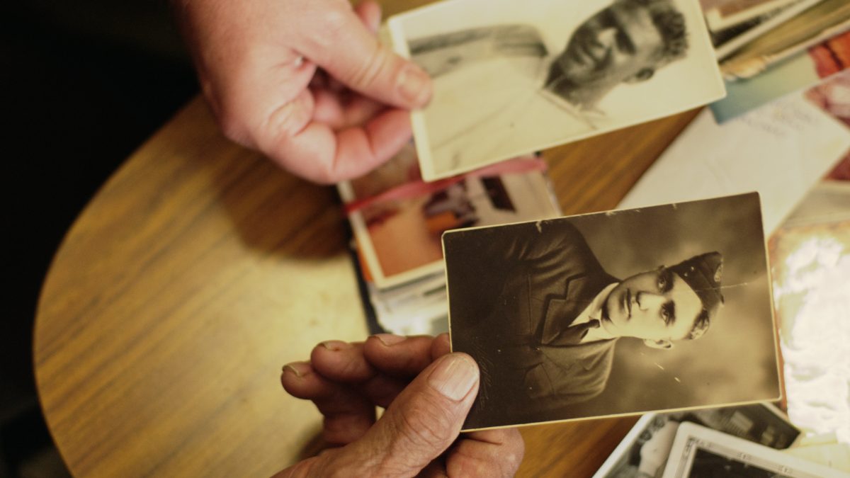 Old photos being passed between hands