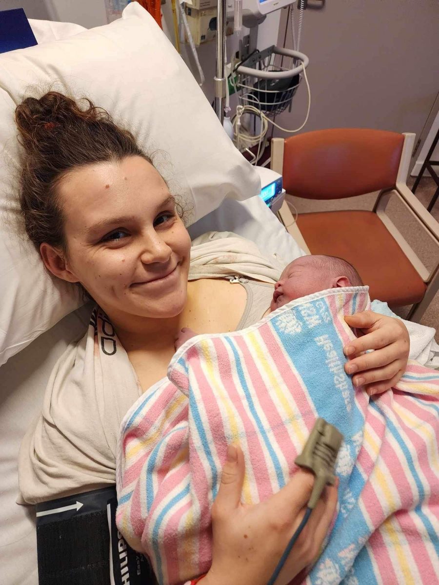mum and newborn bub in hospital bed