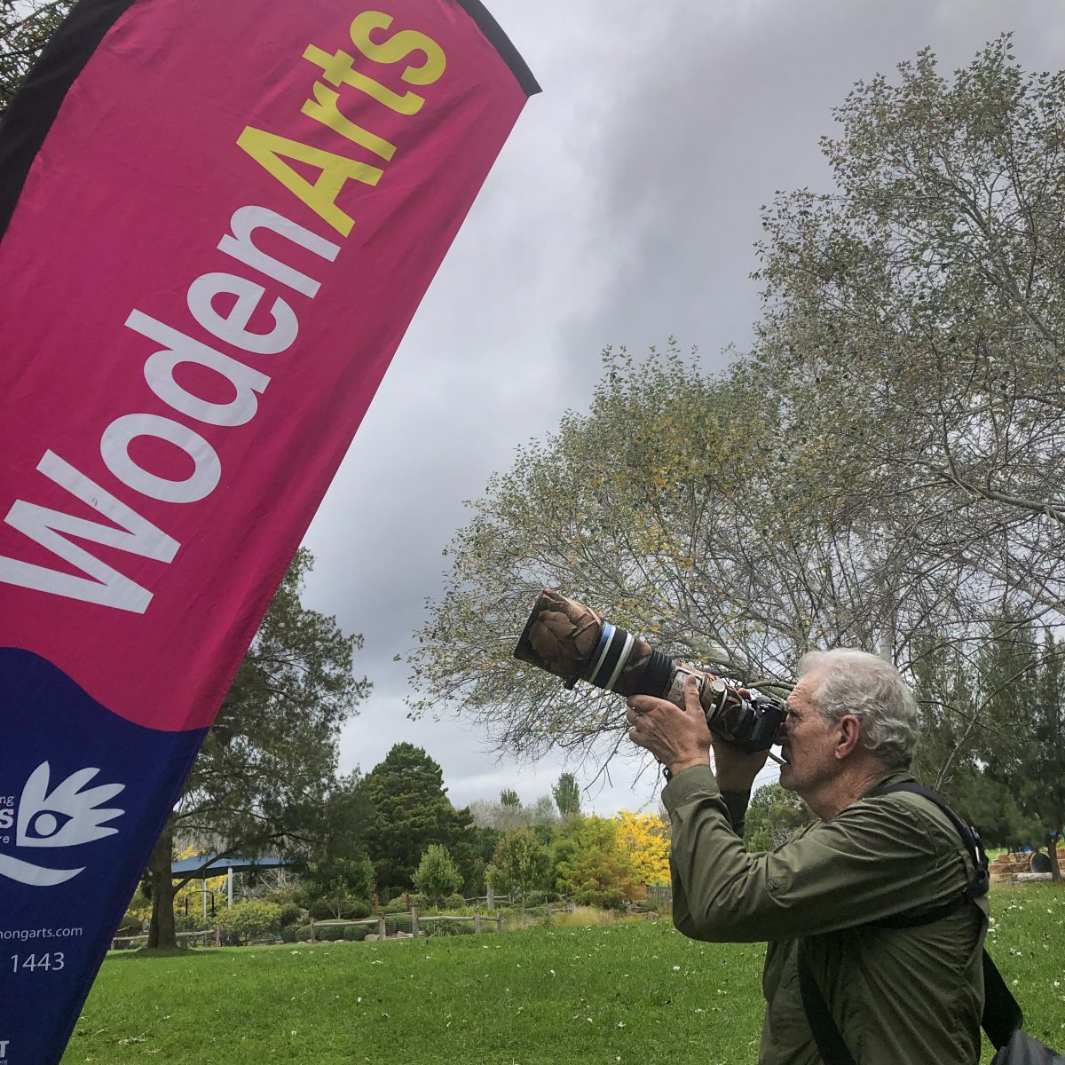 Photographer shooting with long lens