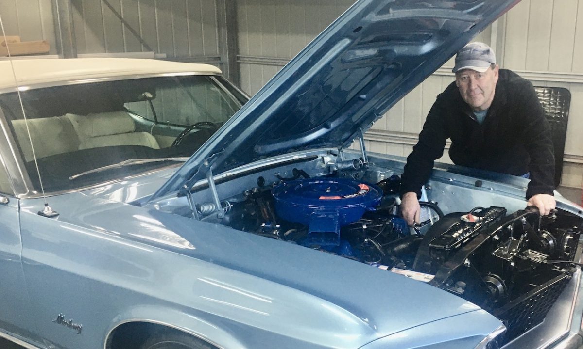 Man looking at engine.