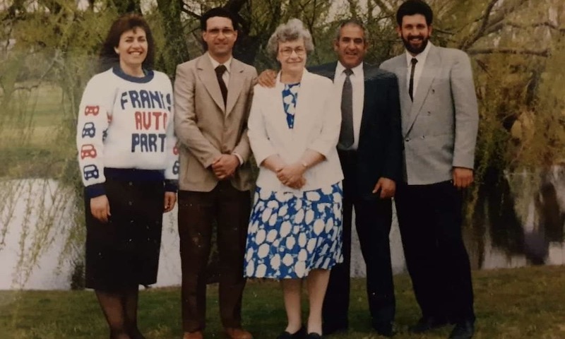 Five adults standing.