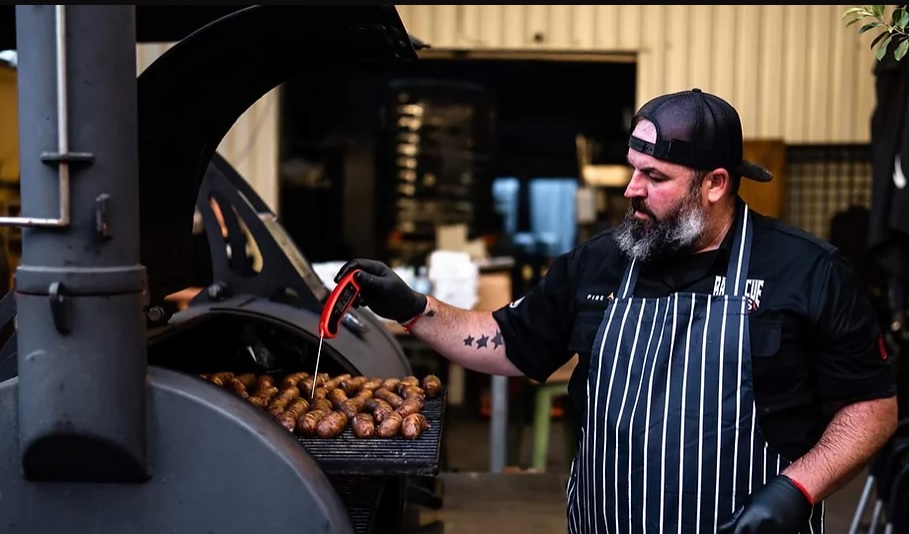 man barbecuing meat