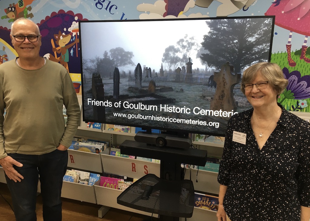 man and woman in front of TV screen 