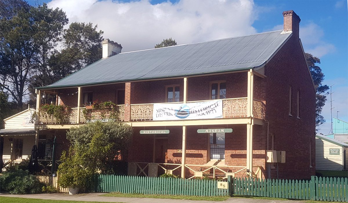 An image of two-story a building with a banner 