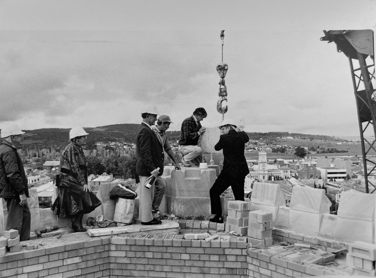 People on top of building under construction
