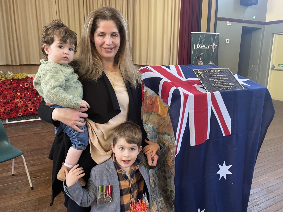 Sarah McGrath with her sons Mitchell and Harrison with the Legacy plaque after the dedication at the Yass Memorial Hall.