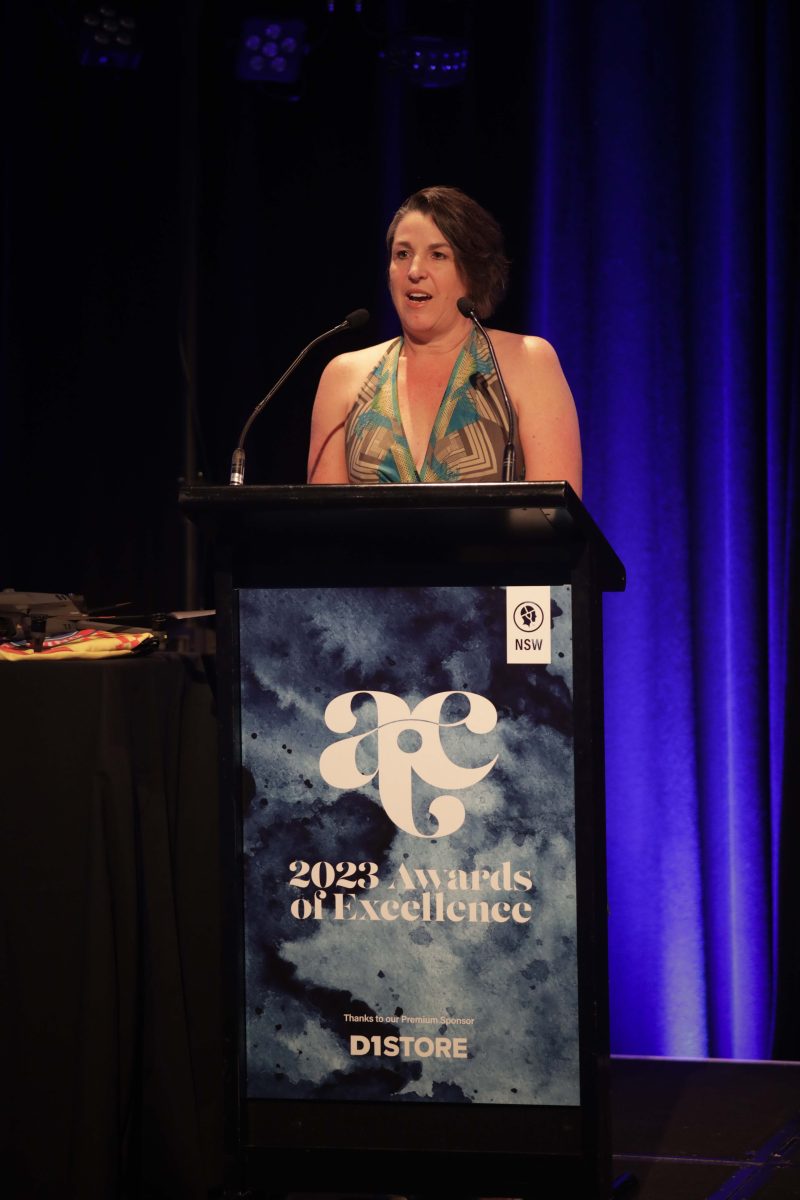 woman speaking at lectern