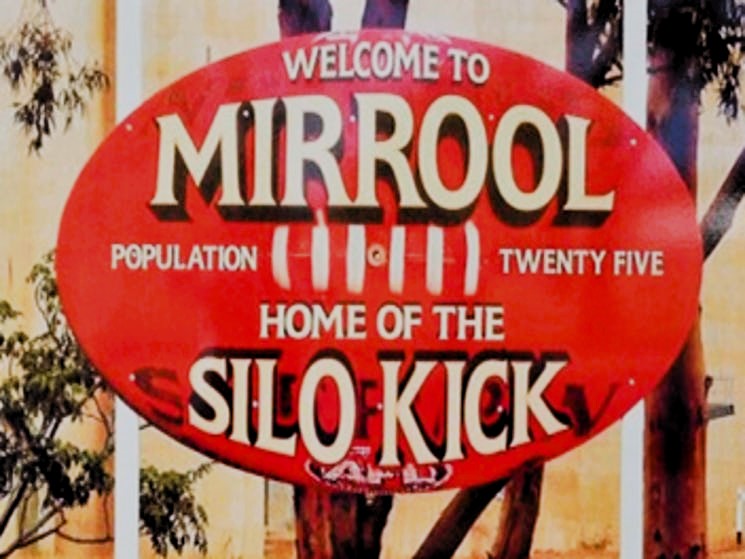 Red oval sign welcoming visitors to Mirrool, Home of the Silo Kick.