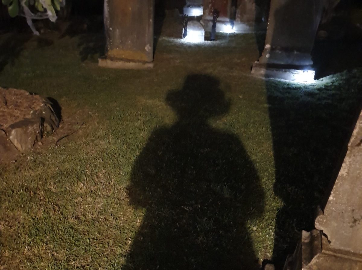 shadow of woman in graveyard