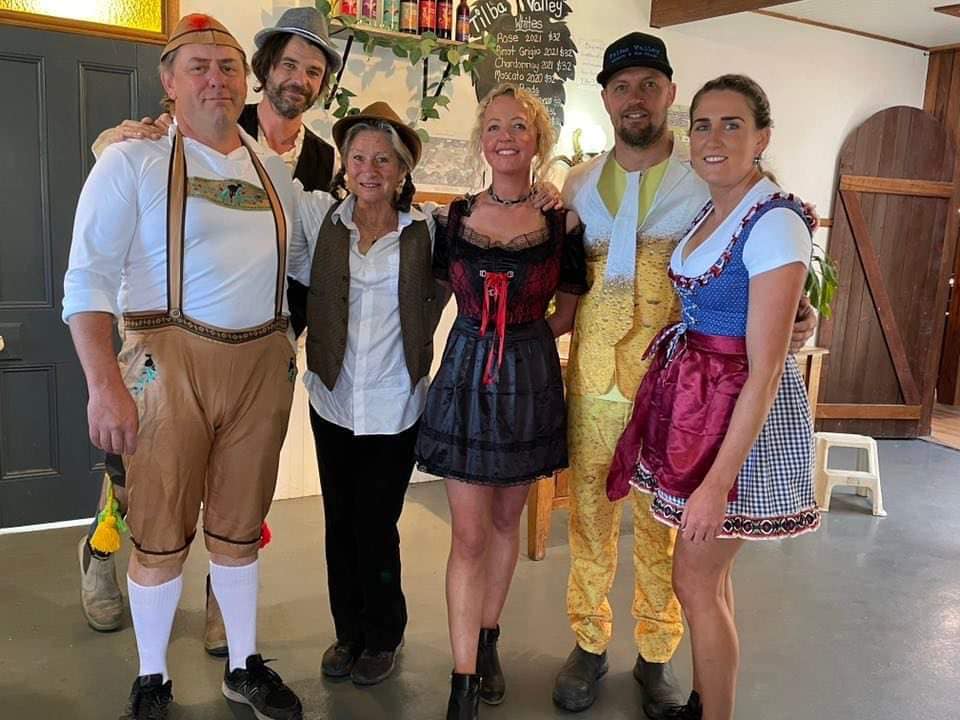 People dressed in Oktoberfest-inspired costumes