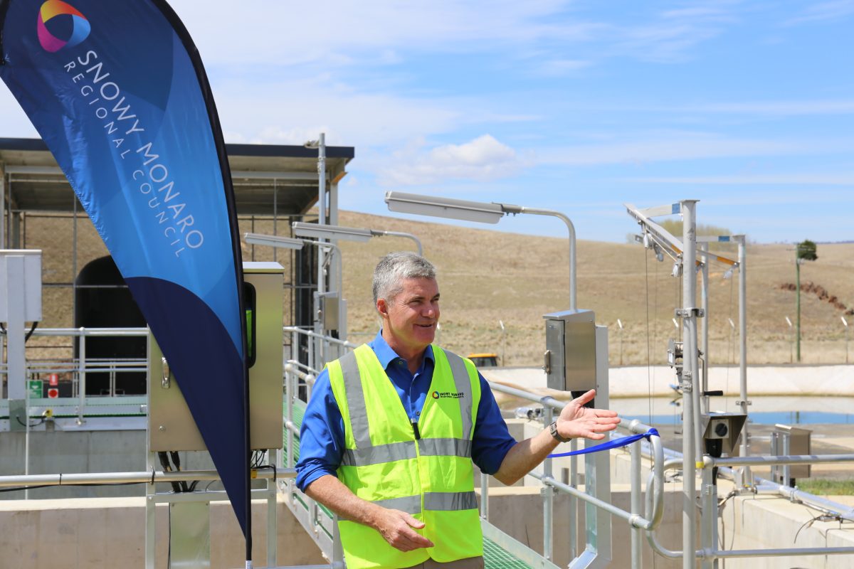 Monaro MP Steve Whan stands before the new sewerage plant in Adaminaby.