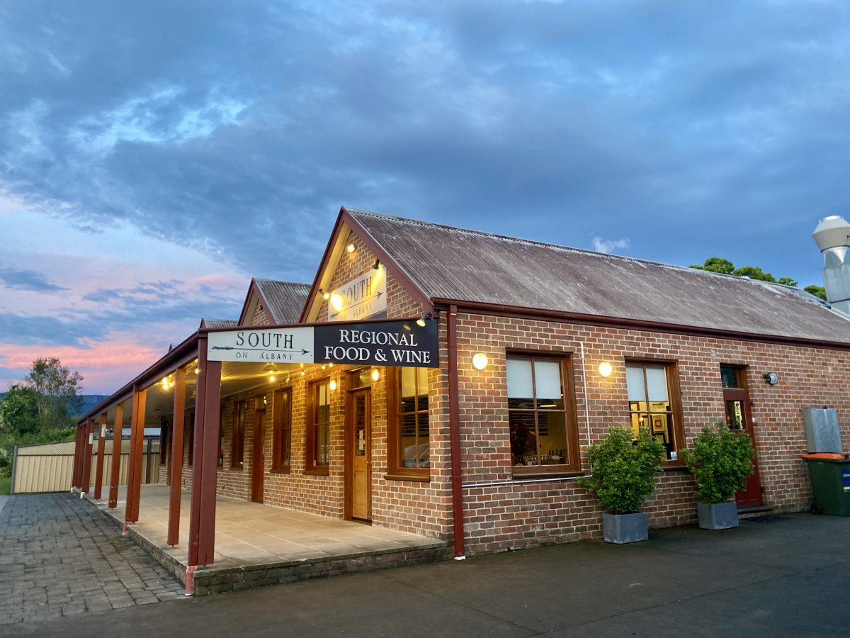 Exterior of restaurant building at sunset