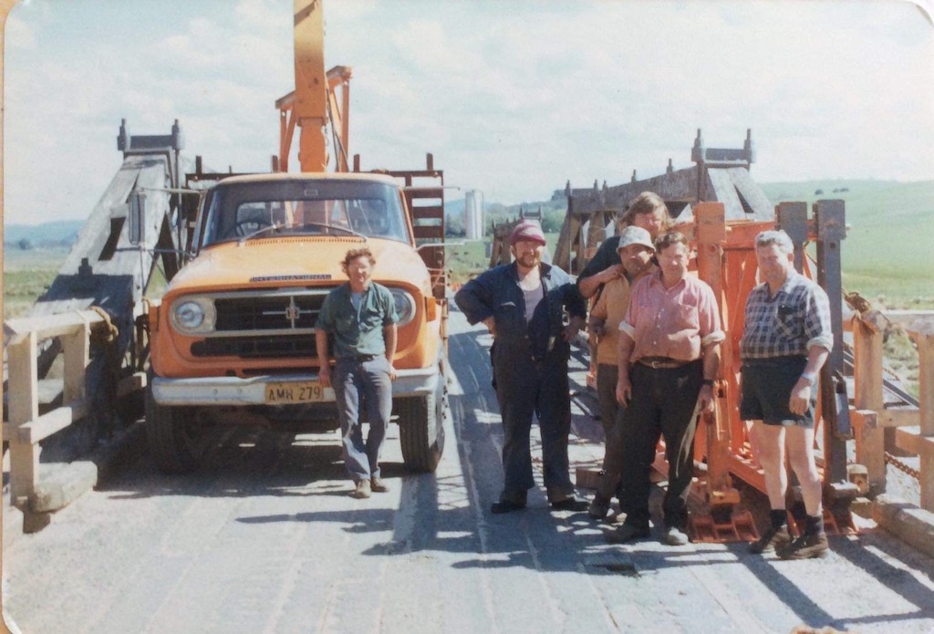 old photo of men working on bridge