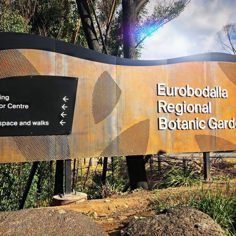 An outdoor sign for the Eurobodalla Regional Botanic Gardens.
