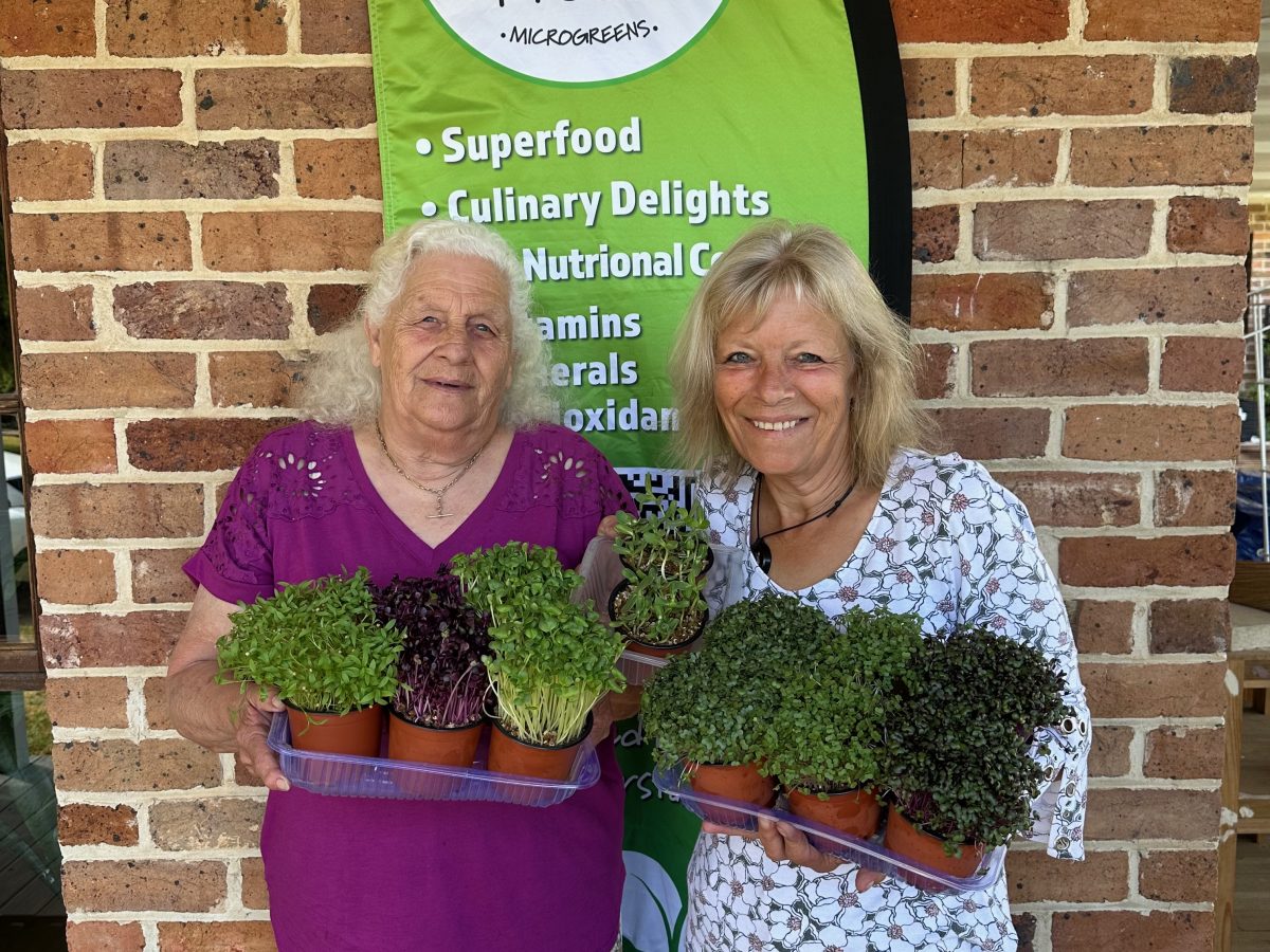 two women with microgreens