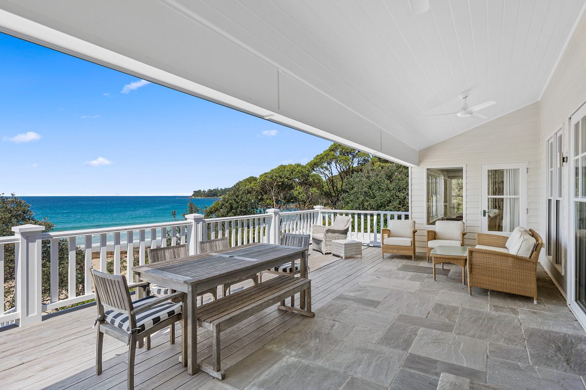 A photograph from inside the home overlooking the sea