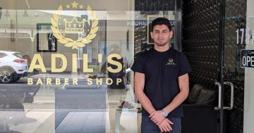From refugee camps to his own main street barbershop: Adil is shaving his way to the top