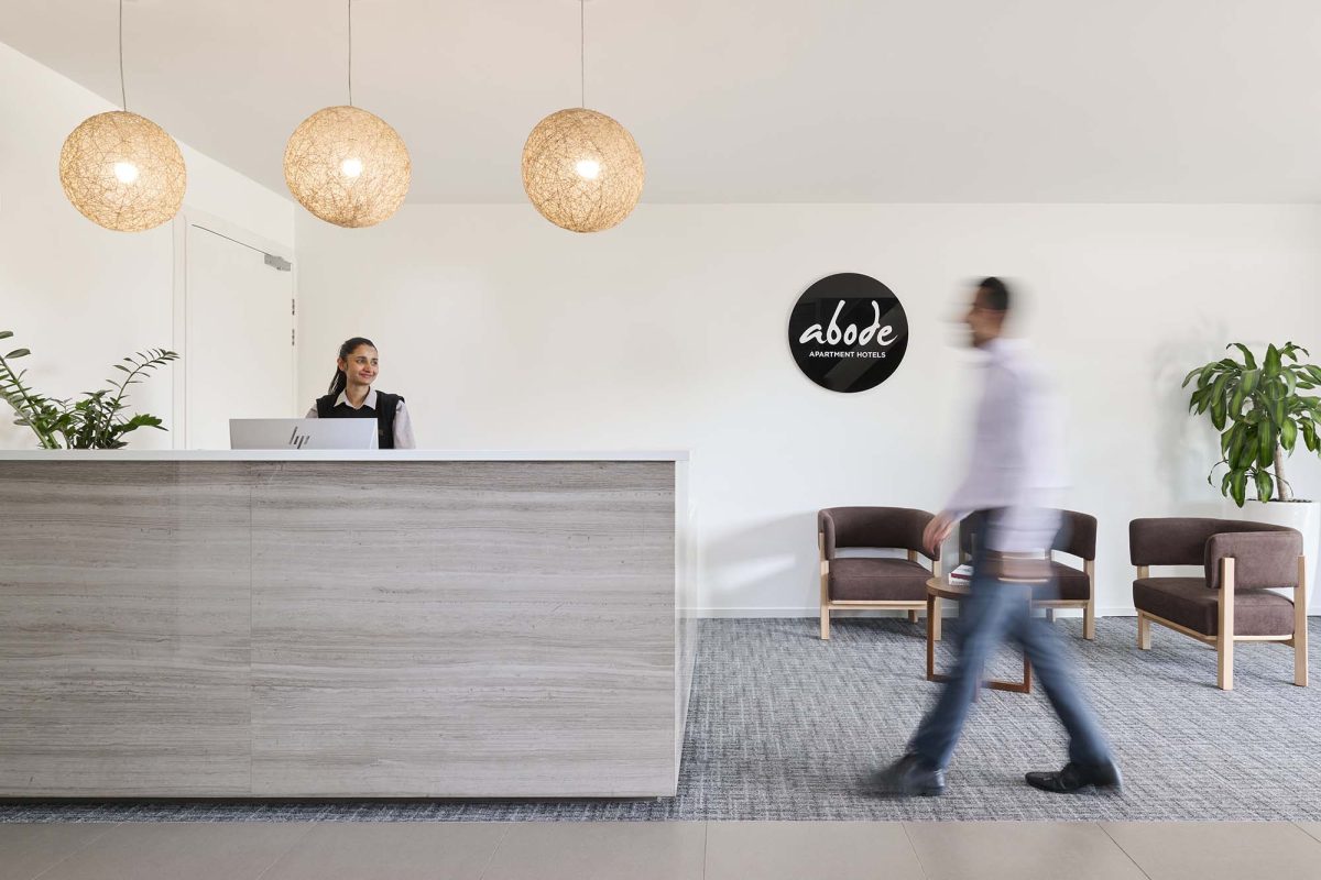 a person walking through the lobby of a hotel