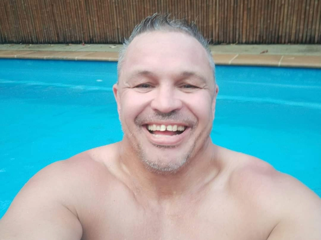 man taking selfie in swimming pool
