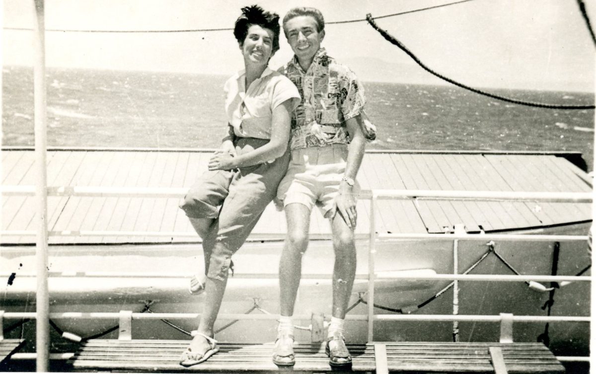 Black-and-white image of woman and man on boat