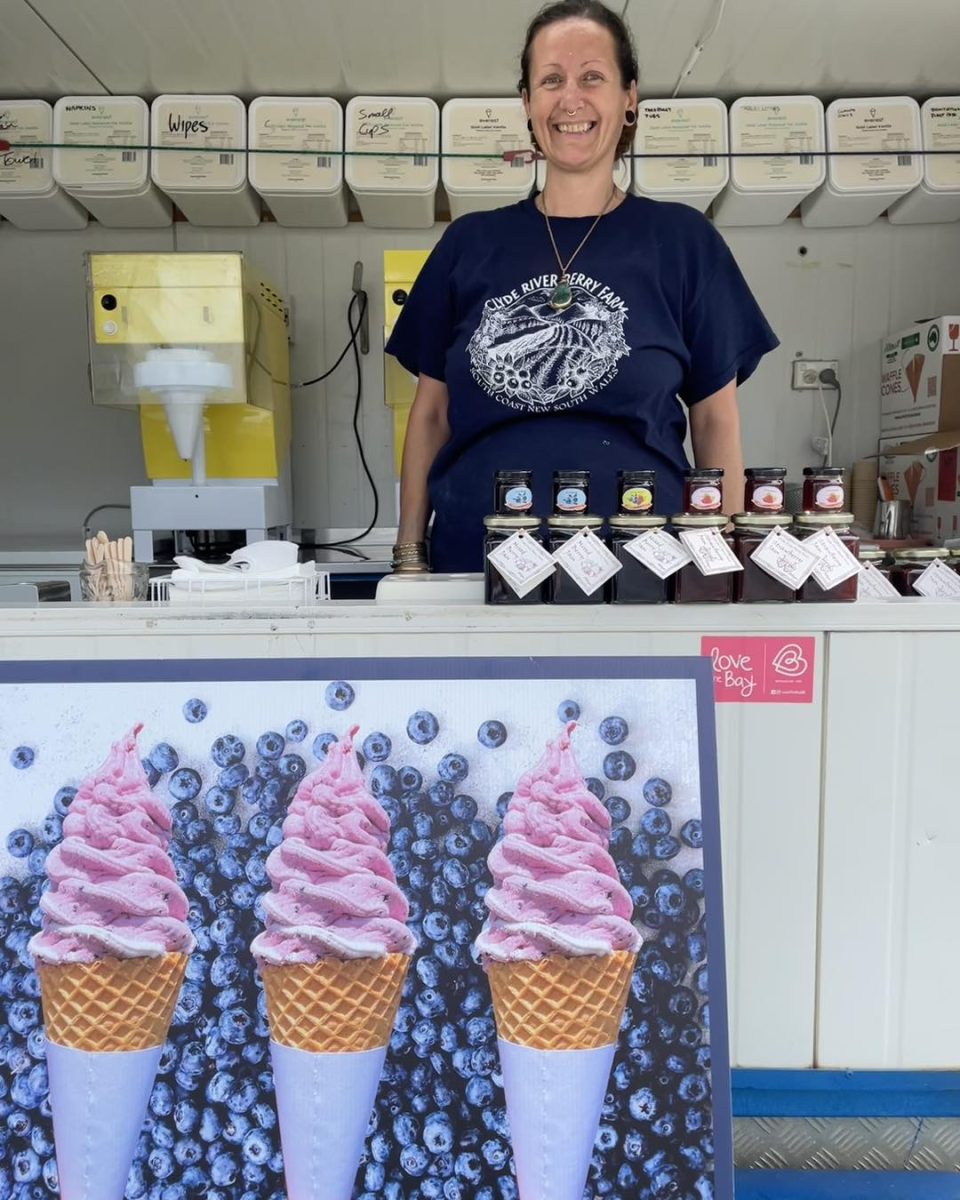 Attendant standing in an ice cream van.