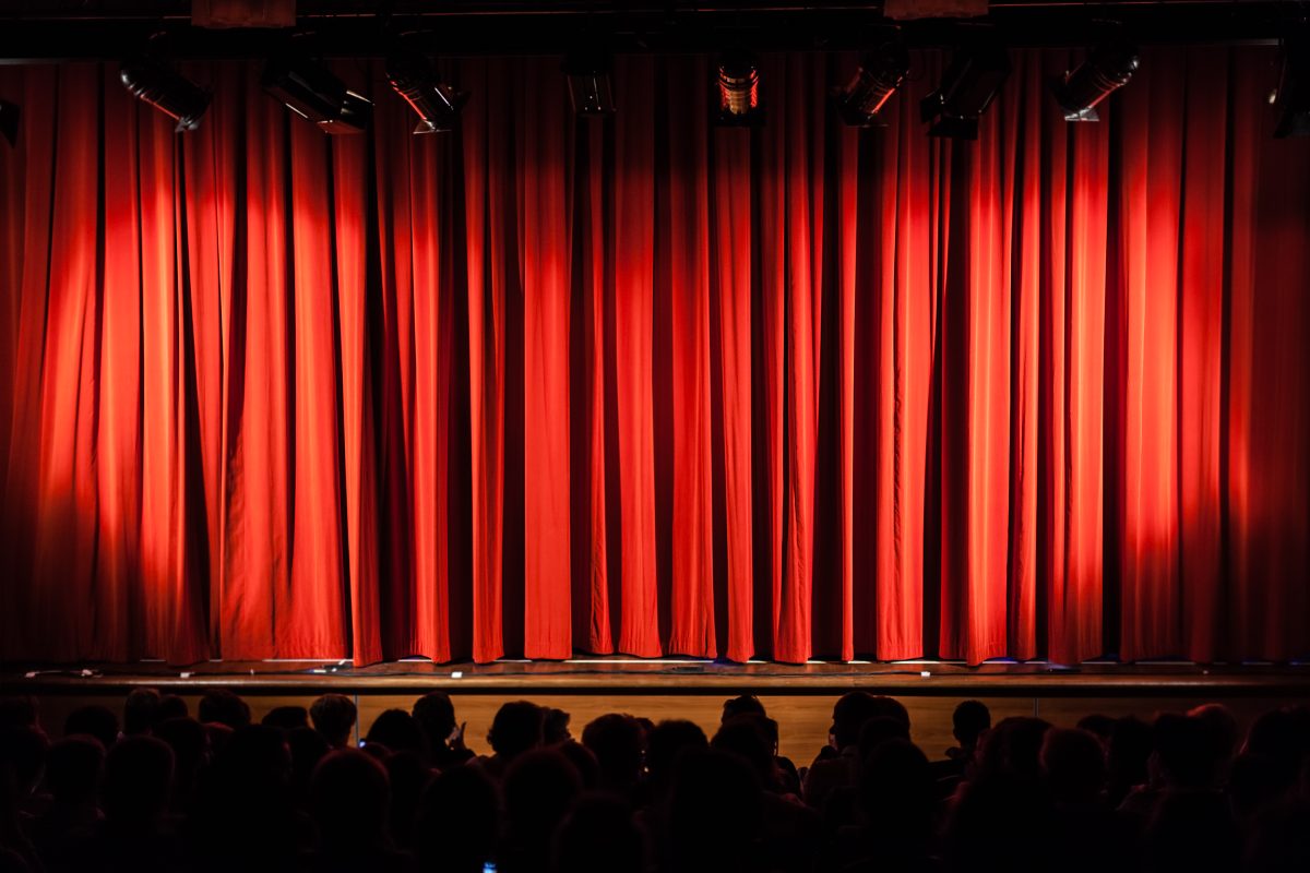 A red curtain across a stage