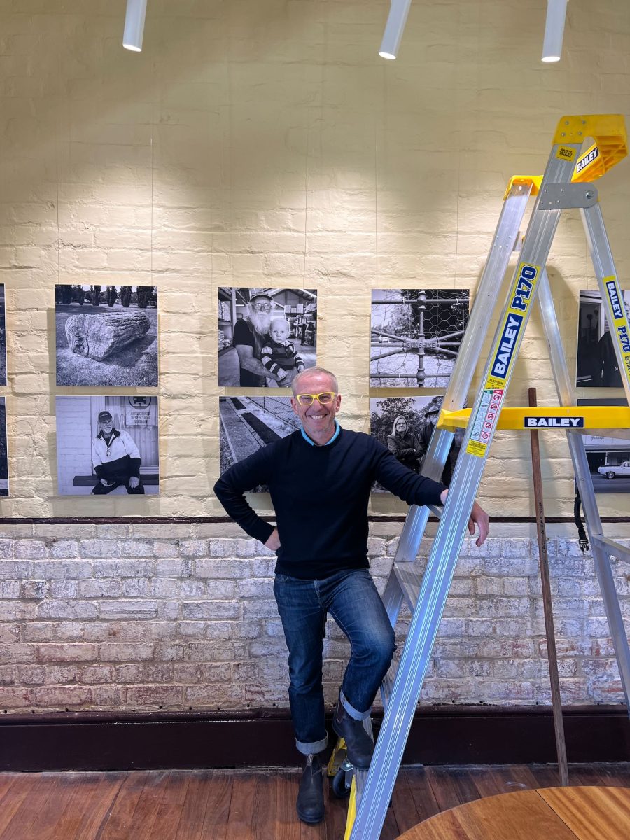 Man with ladder in studio