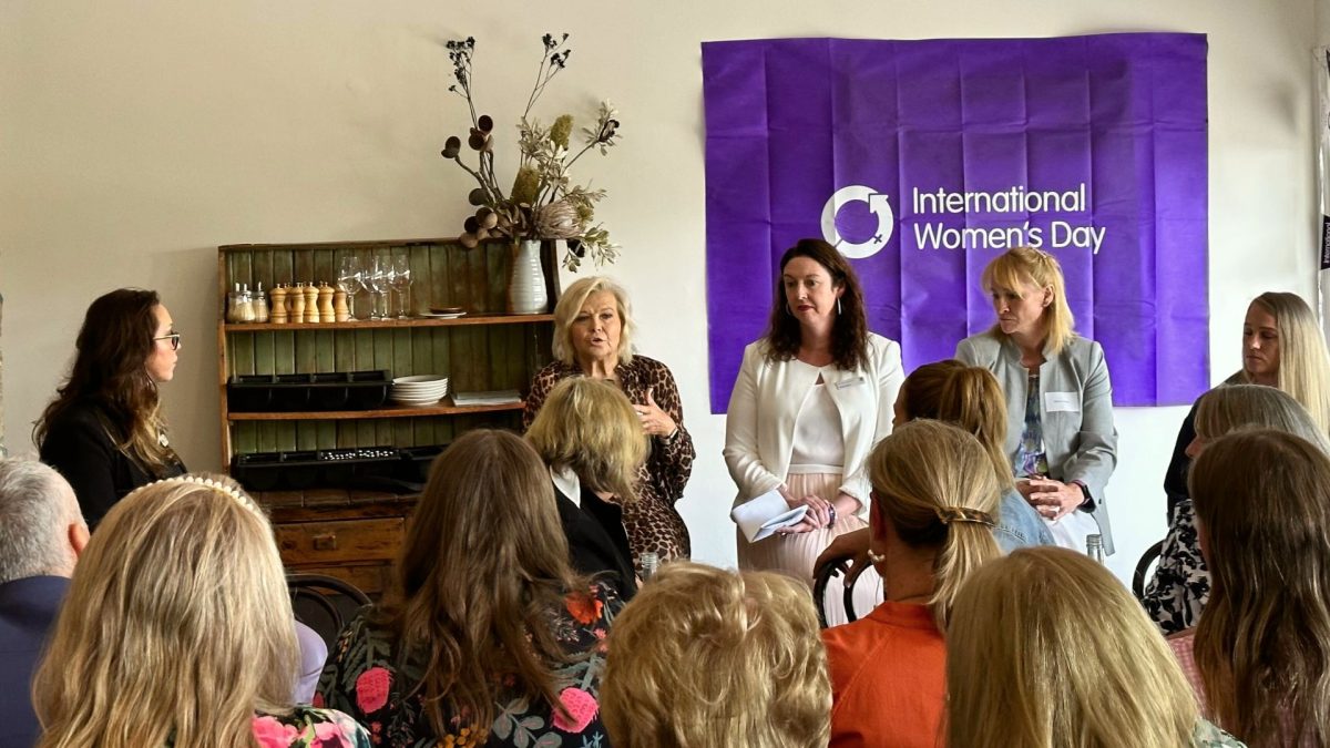 Women listening to an all-female panel talk