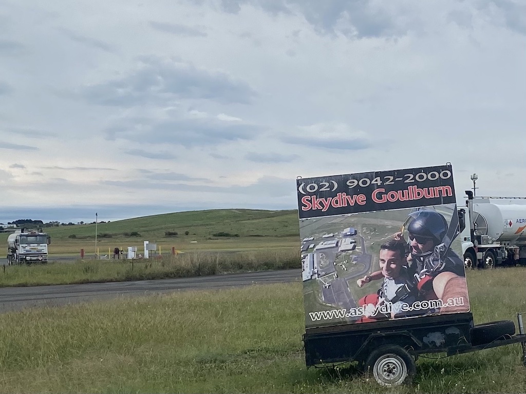 skydiving billboard on country roadside