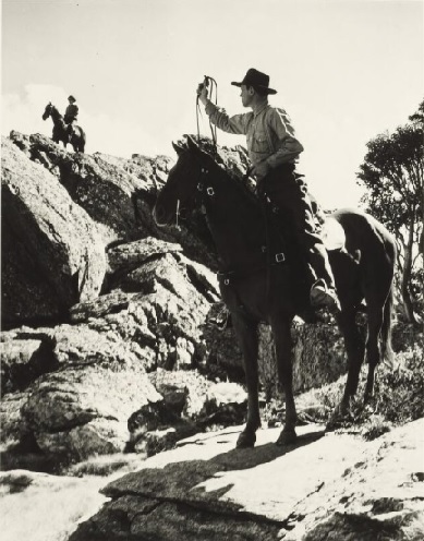 Old photo of men on horses
