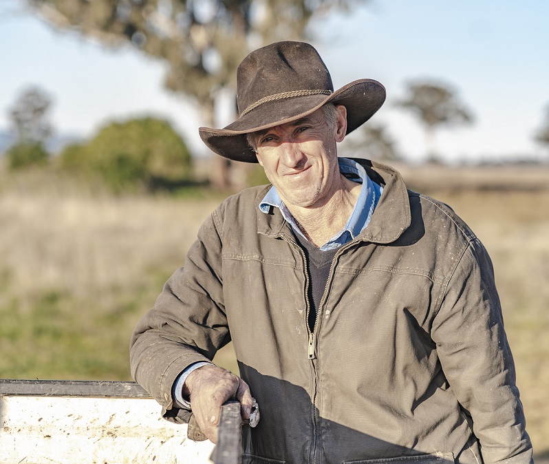 farmer leaning on ute