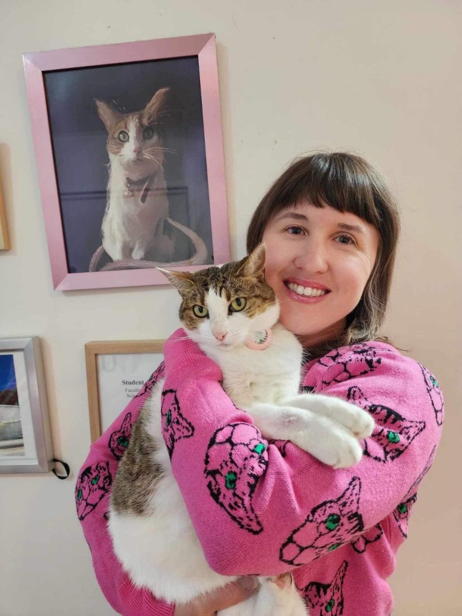 Merimbula's Dr Jodie Stewart is ably assisted by her cat Poppy while she researches the history of felines in Australia. 