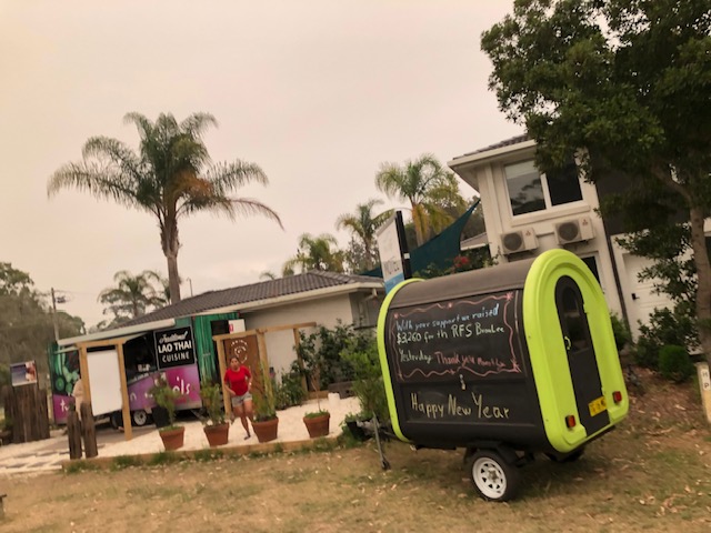 Two Sisters on Wheels Food van with chalkboard writing.