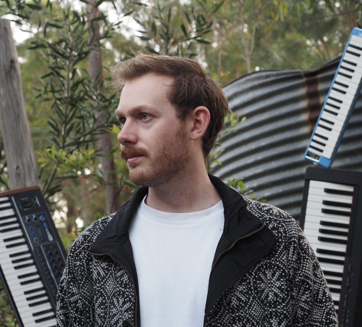 Man in front of keyboards