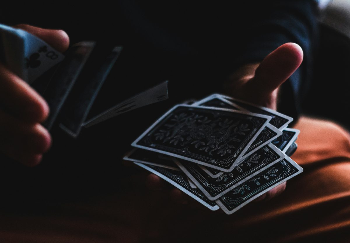 A person shuffling cards