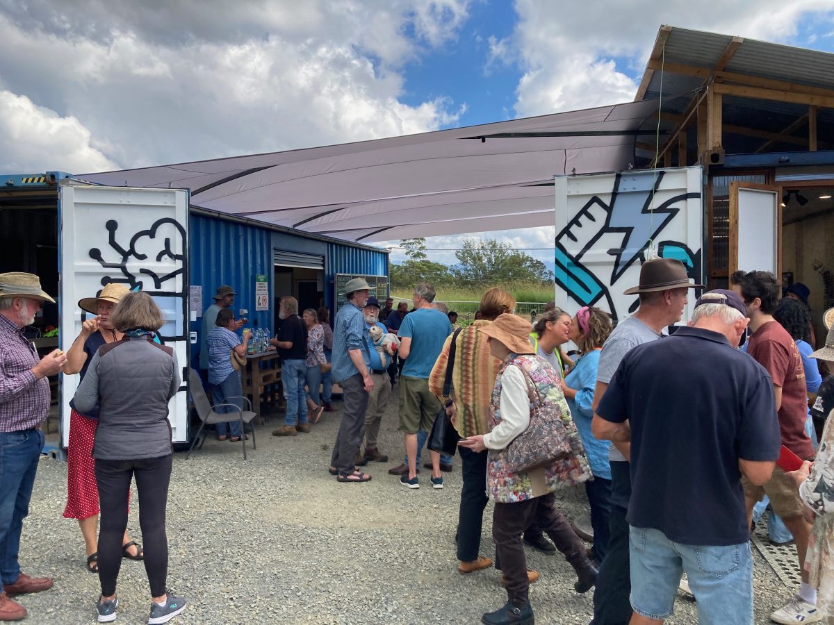 People standing at the Community Solar Reuse Centre