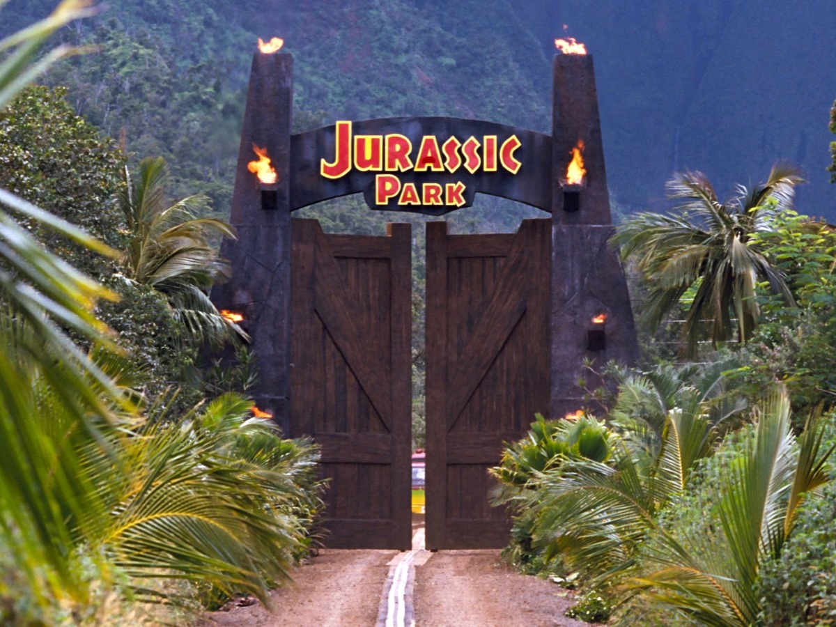 A still from the movie showing the entrance to the fictional park 