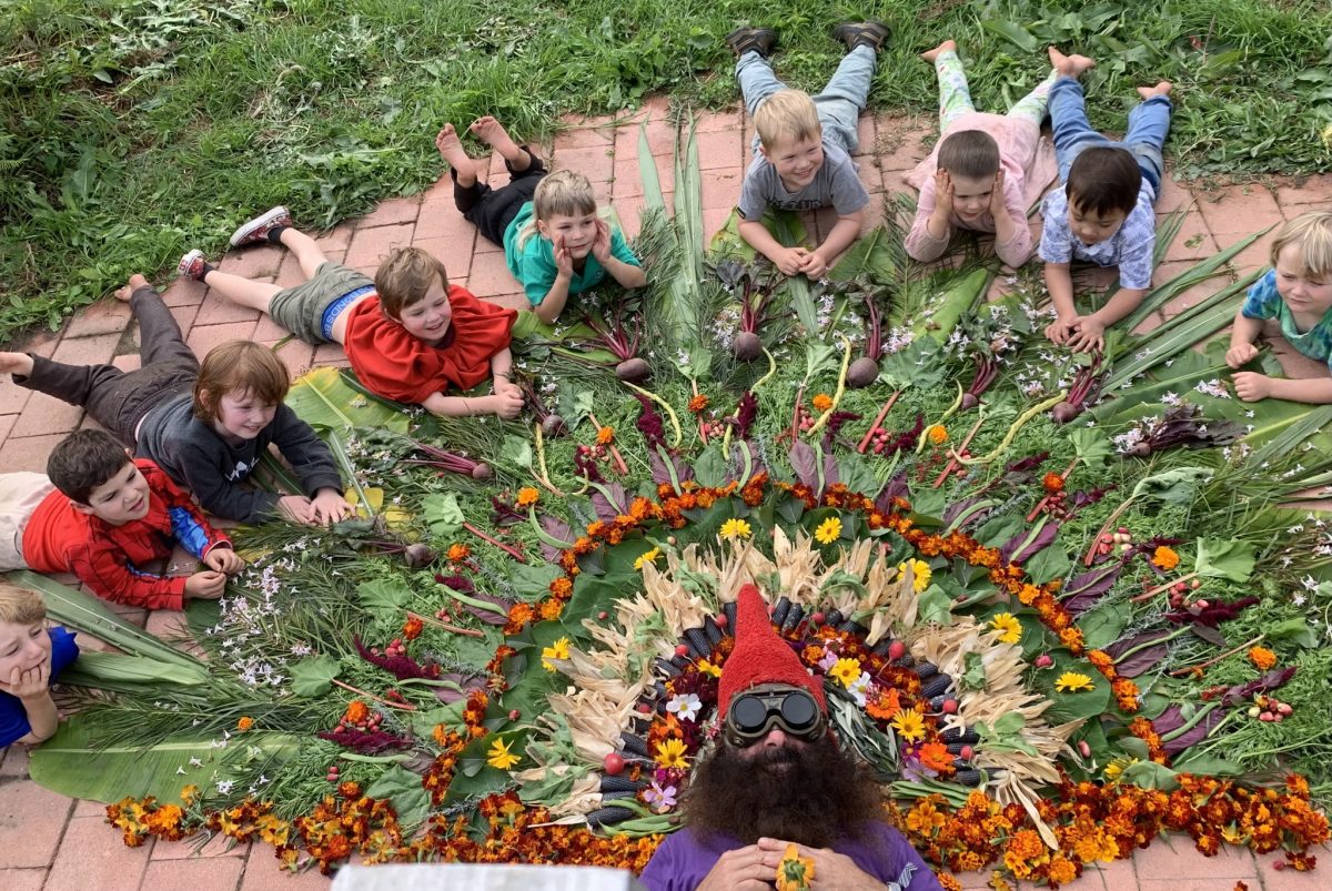 Costa of Gardening Australia with the autumnal mandala children from Bermagui Preschool made on 9 May. Photo: Eat Dirt Permaculture.