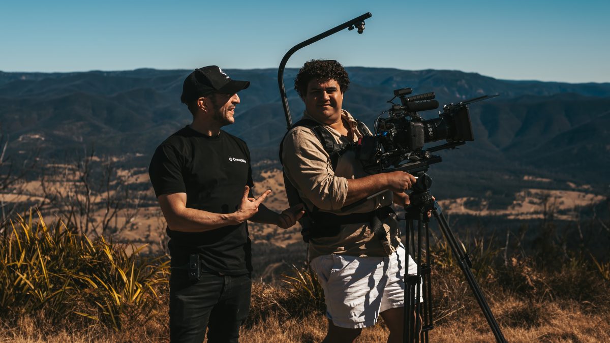 two men with film equipment