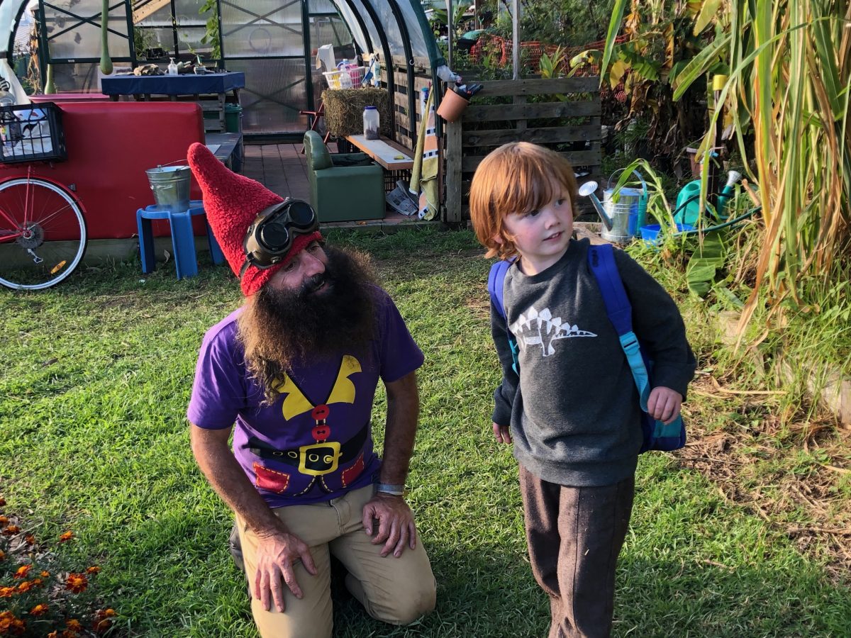 Costa with one of the children at Moodji Farm in Bermagui.
