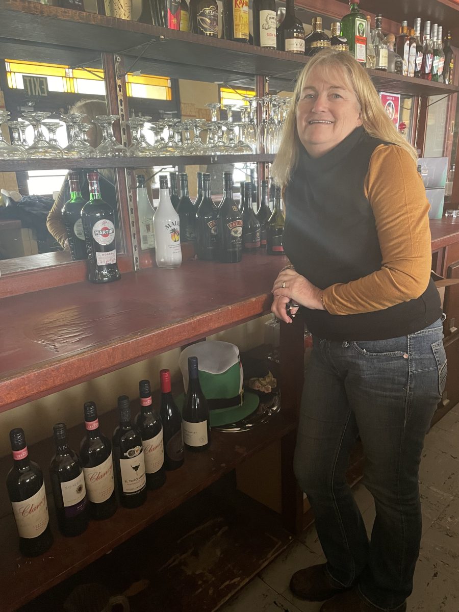 woman behind bar at old pub