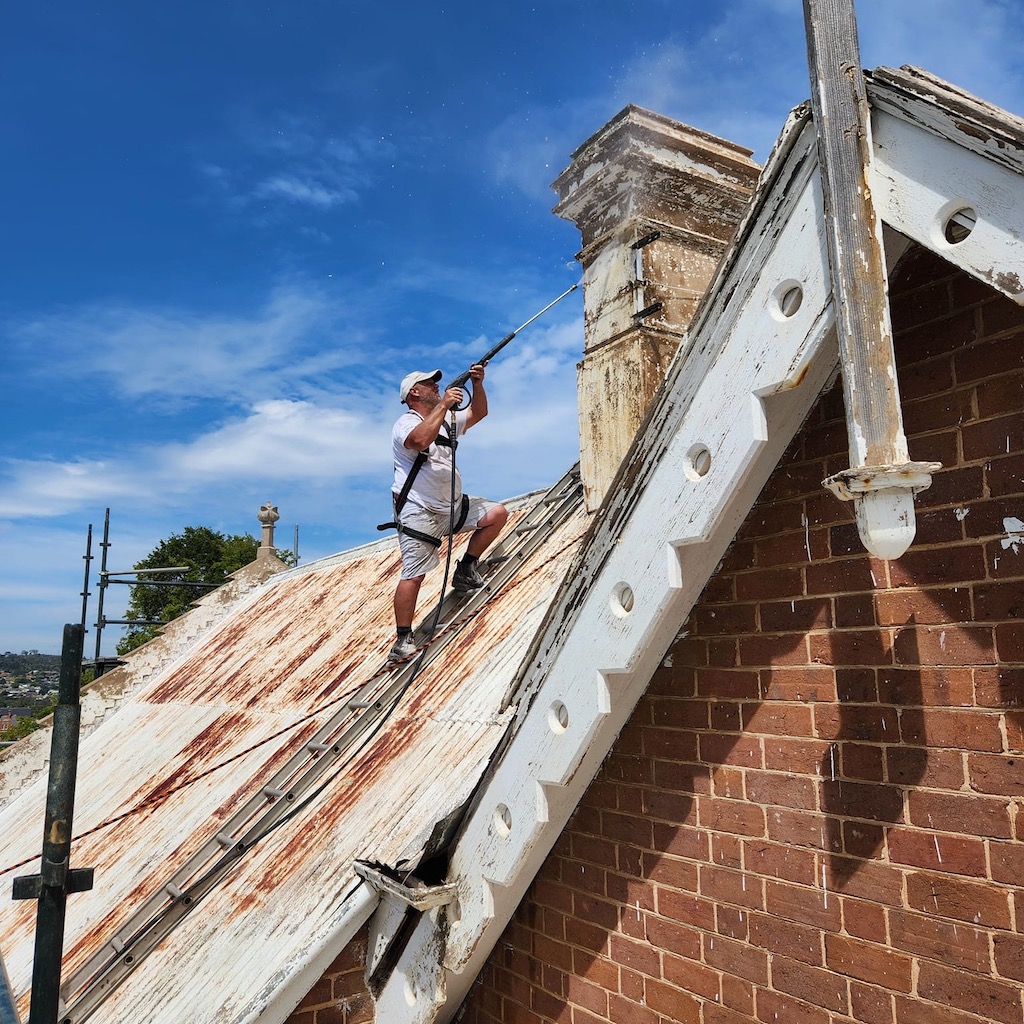 Evan Dodds cleaning one of the chimneys on Highgate.