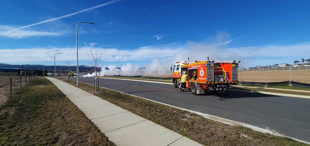 A burning pile and a fire truck