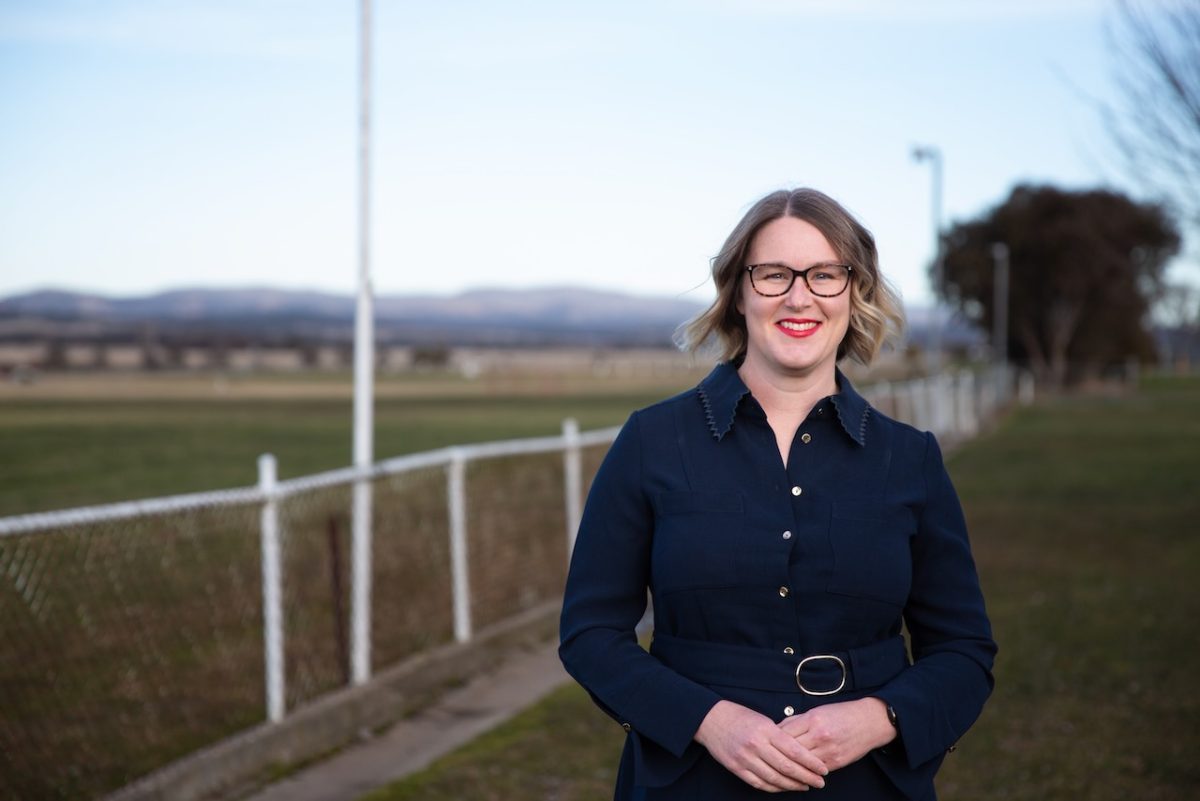 A woman smiling at the camera at showgrounds