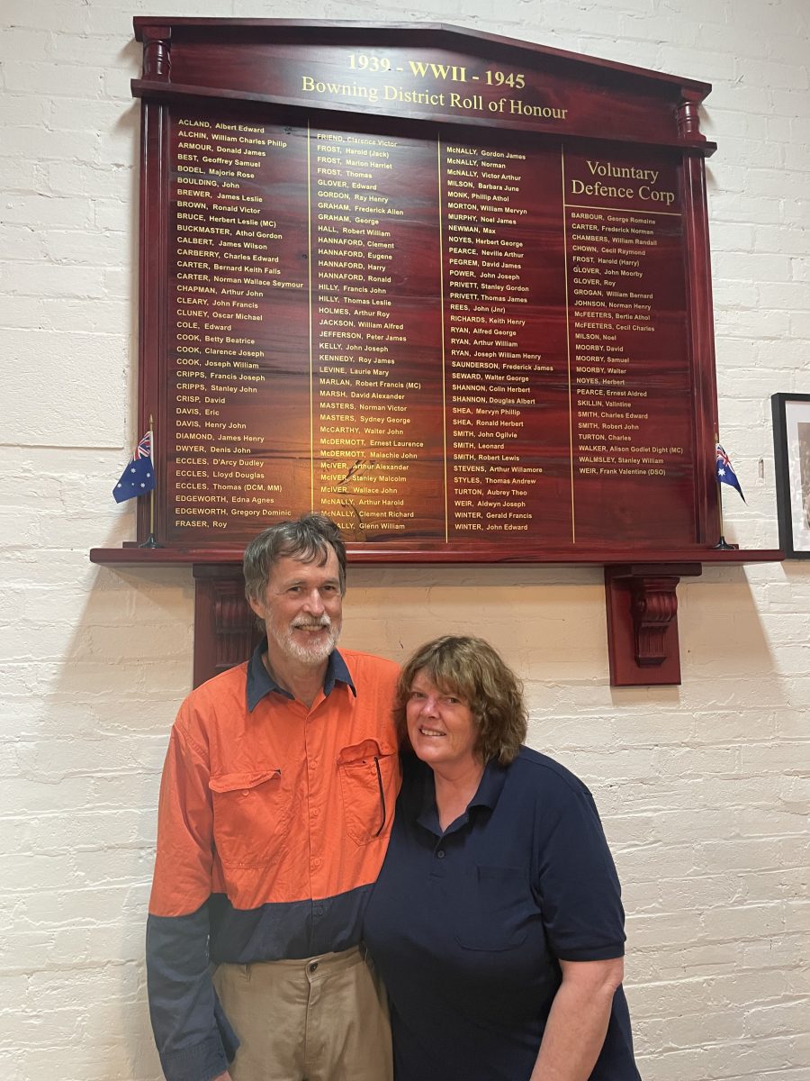 Couple standing in front of honour board