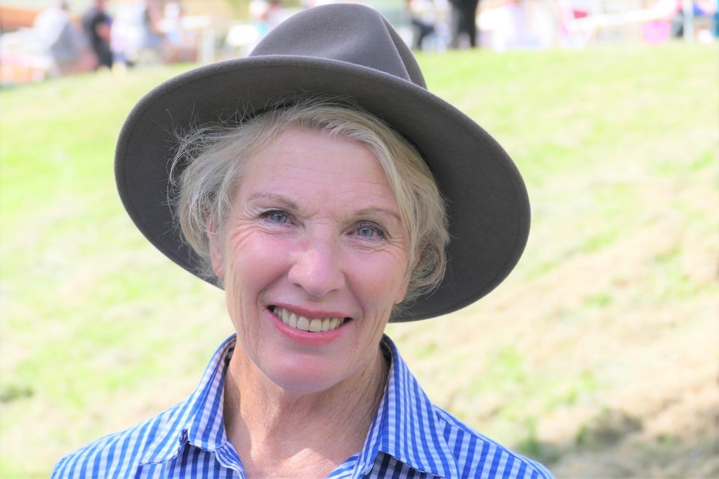 smiling woman wearing a hat