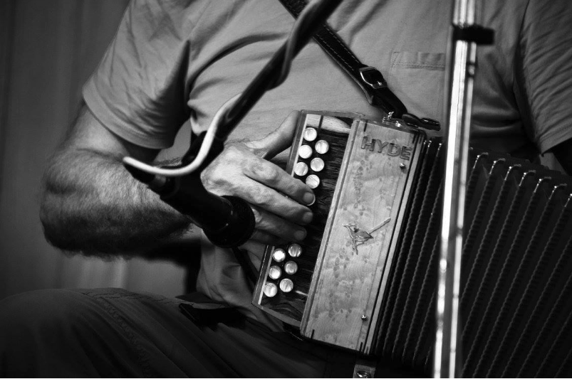 man playing an accordion